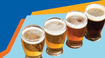 Photo of four beers against a yellow and blue background.