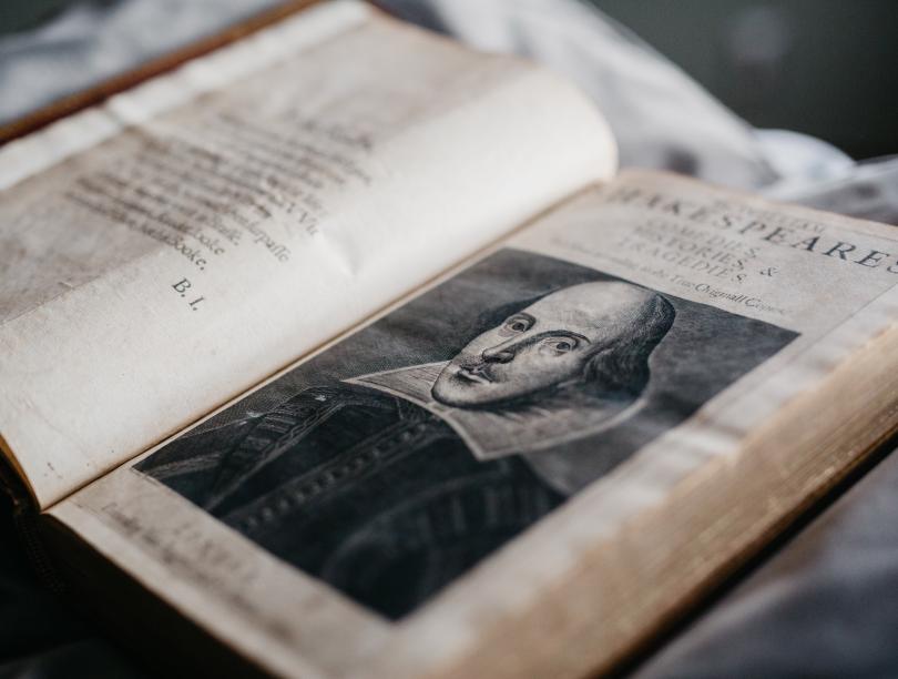 Inside spread of William Shakespeare's First Folio showing an illustration of the author