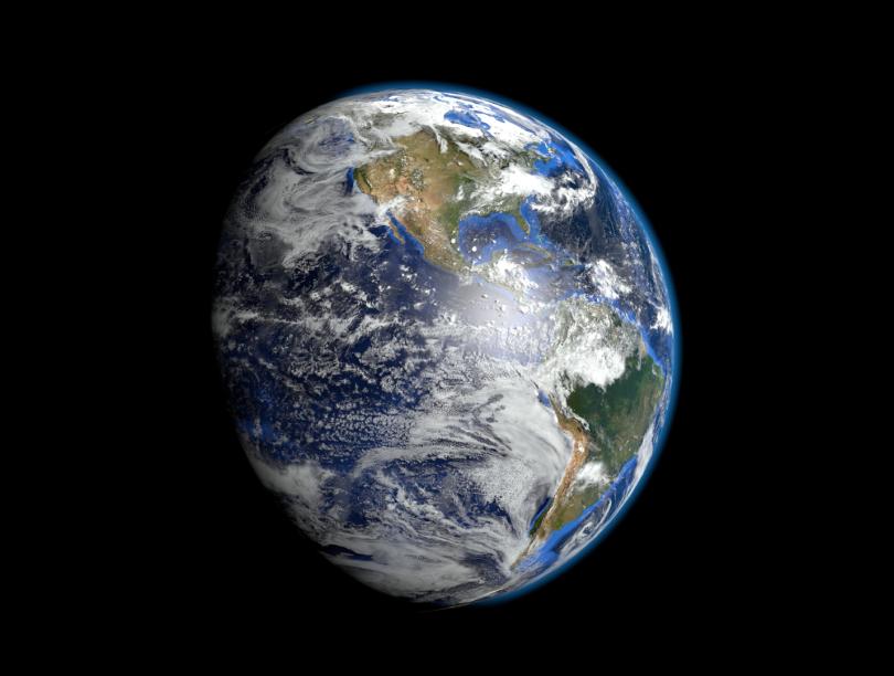 Zoomed out photo of Earth against the galaxy.
