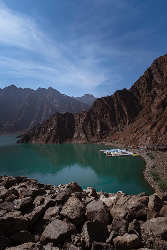 Wide-angle, high-up shot of the mountains and water in Hatta, UAE