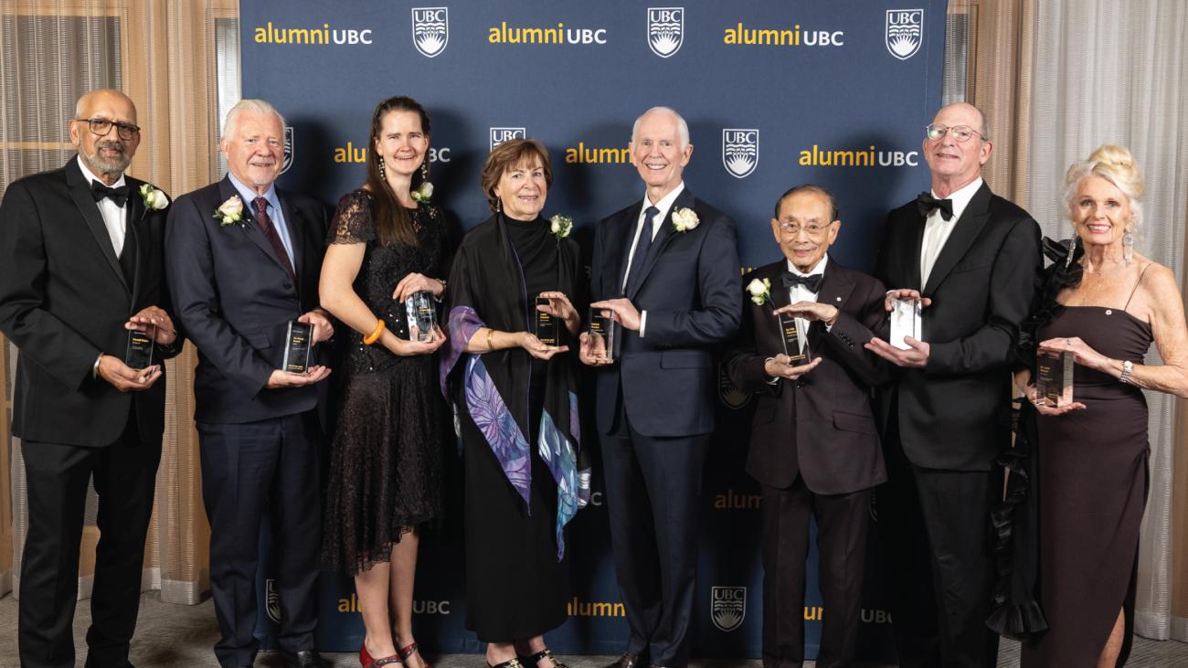 2023 alumni UBC Achievement Awards recipients holding their awards at the gala