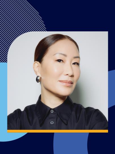 Headshot of Jennifer Wong wearing a black collared shirt over a blue background